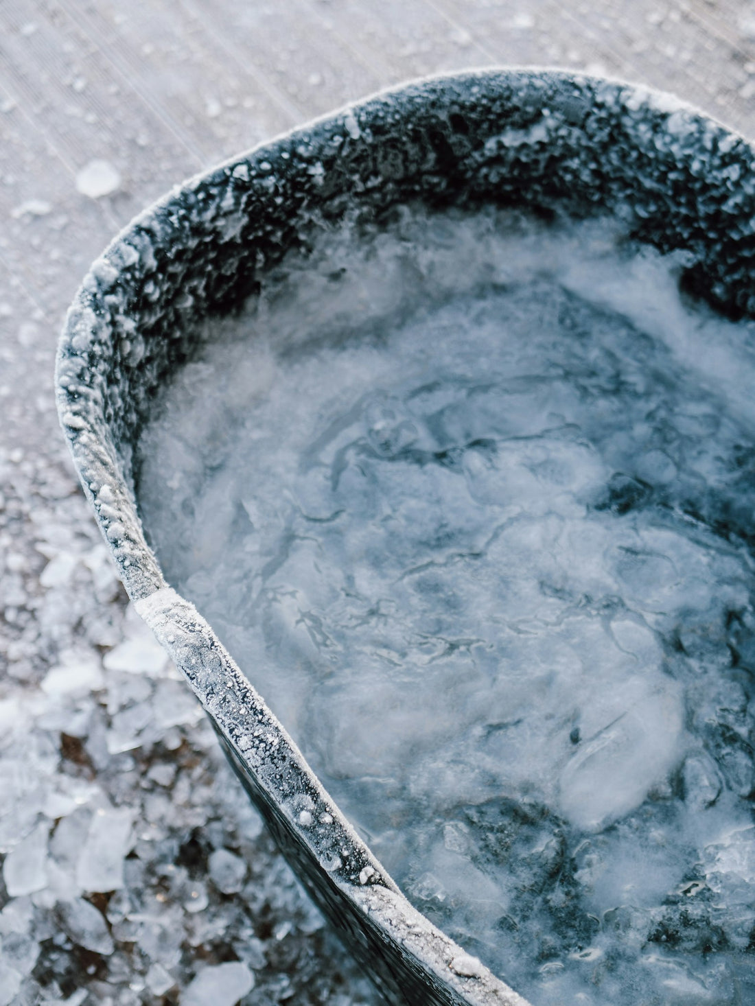 Close-up of an ice bath tub filled with icy water and floating ice